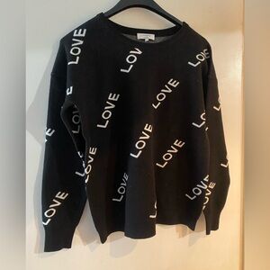 J Society black sweater with white letters spelling out love NWOT